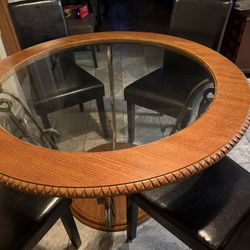 Circle Wood And Glass Table With 4 Black Leather Chairs