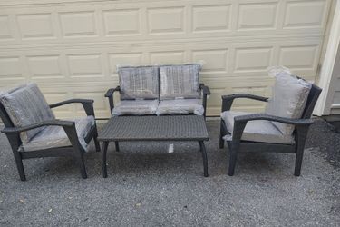Outdoor patio wicker couch with chairs and coffee table