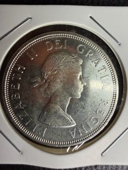 1964 CANADIAN SILVER DOLLAR 0.6 OZT OF SILVER