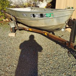 12ft Aluminum With 7.5 HP Mercury Outboard. 