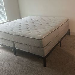 King mattress and box springs with a frame