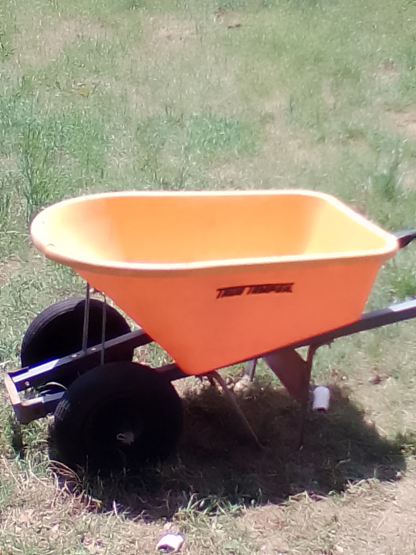 TRUE TEMPER TWO WHEEL 8 CUBIC FOOT POLY WHEELBARROW. $20 cash today only! First person here gets it