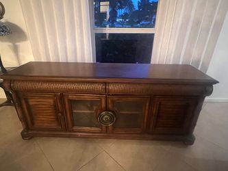 FREE!! The Cindy Crawford Home Key West Tobacco Console features a rich tobacco finish, woven rattan drawer accents,