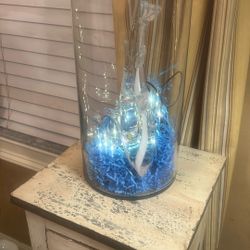 Glass shark or whale and glass face with lights