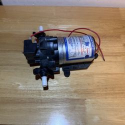 Shurflo 12V diaphragm water pump, commonly used in RVs, boats, and off-grid water systems
