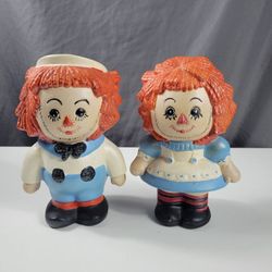 Raggedy Ann and Andy figurines..