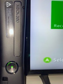 Xbox 360 Slim 4GBs with two controllers