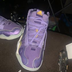 These are the adidas Exhibit B Candace Parker Mid basketball shoes in the "Tech Purple" colorway. 