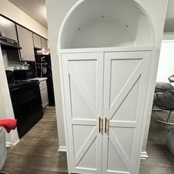 White metal arch cabinet