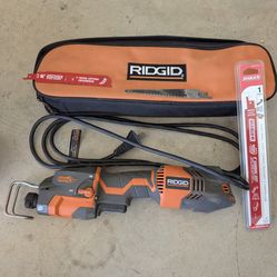 Rigid reciprocating saw with blades