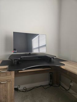 Great combo! Standing Desk + brand new Standing Dual Monitor Desk Stand in box.