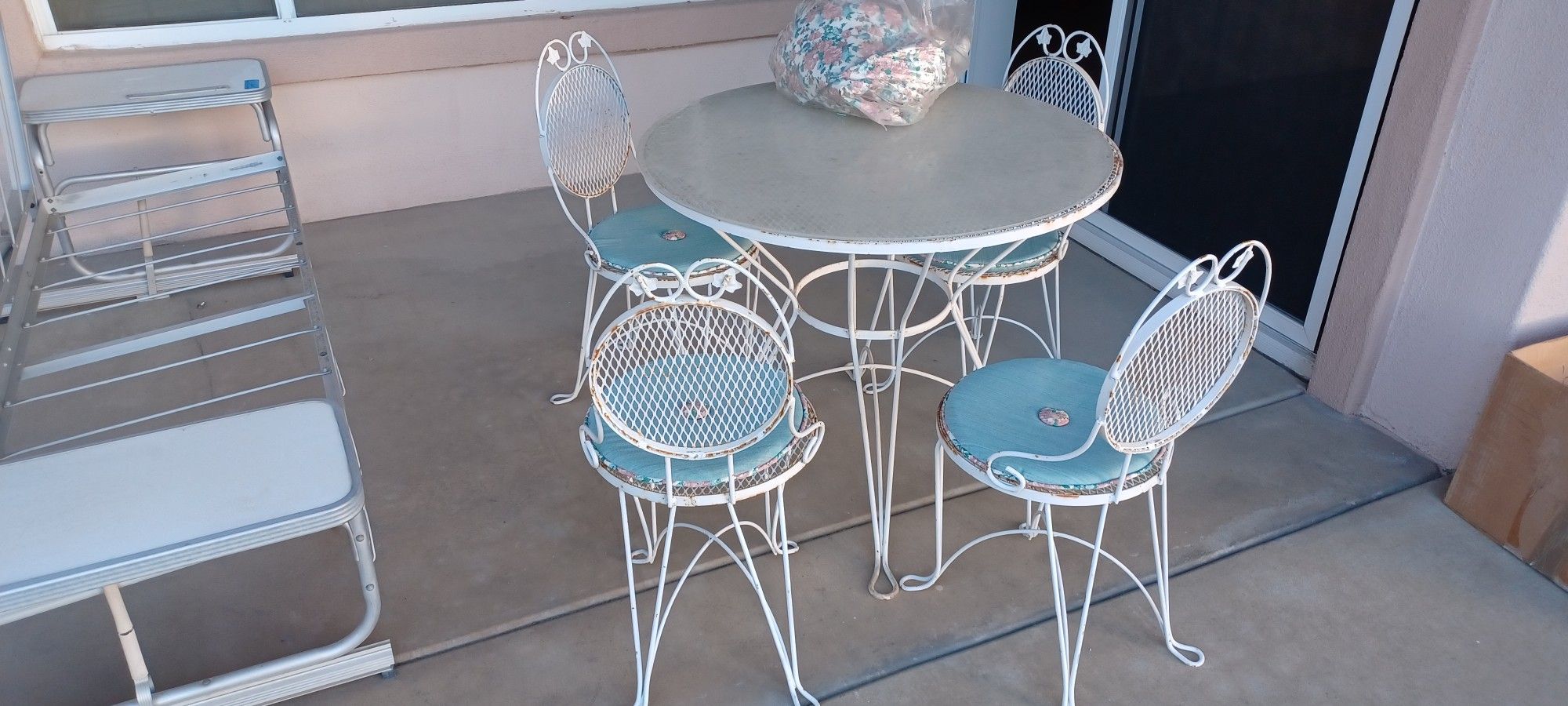 Outdoor Patio Set MCM ICE CREAM PARLOR SET $499obo
White metal table with four matching chairs. Ice cream parlor style including a plexi top, cushions