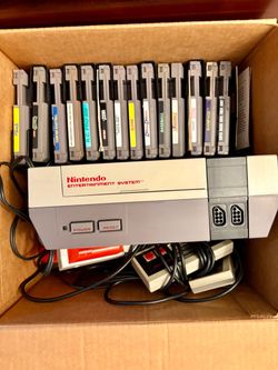 Original NES console package with games.