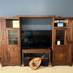 Entertainment center with lights and storage.