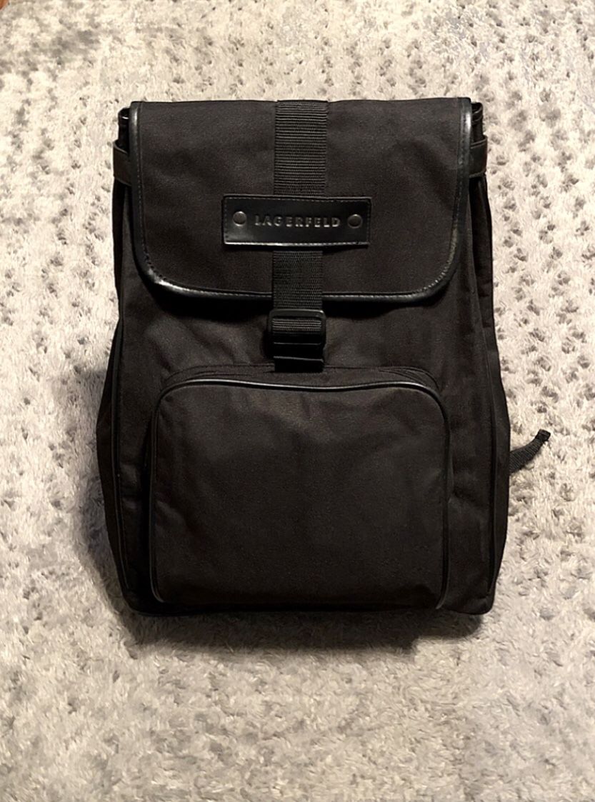 New! Men’s Karl Lagerfeld Backpack lots of storage space including side compartments, and front flap! Very nice bag goes with any outfit, perfect for