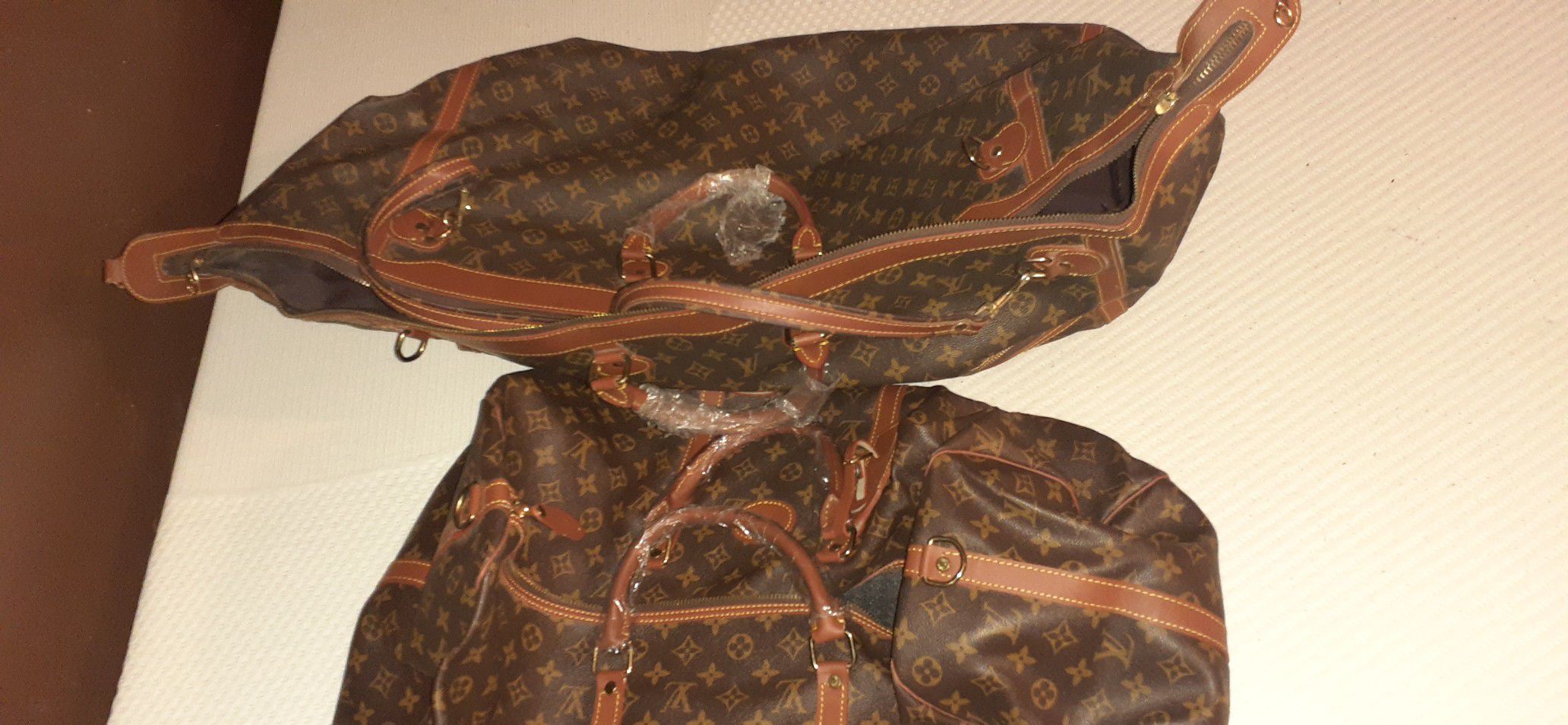 Louis Vuitton large duffle bags other bags available as well $500for large duffle bags