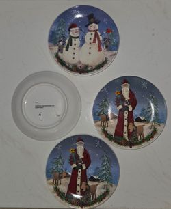 Set of 4 Christmas ceramic decorative plates, each plate is 6 inches in diameter. Primitive folk art holiday design, includes three Santa plates and o