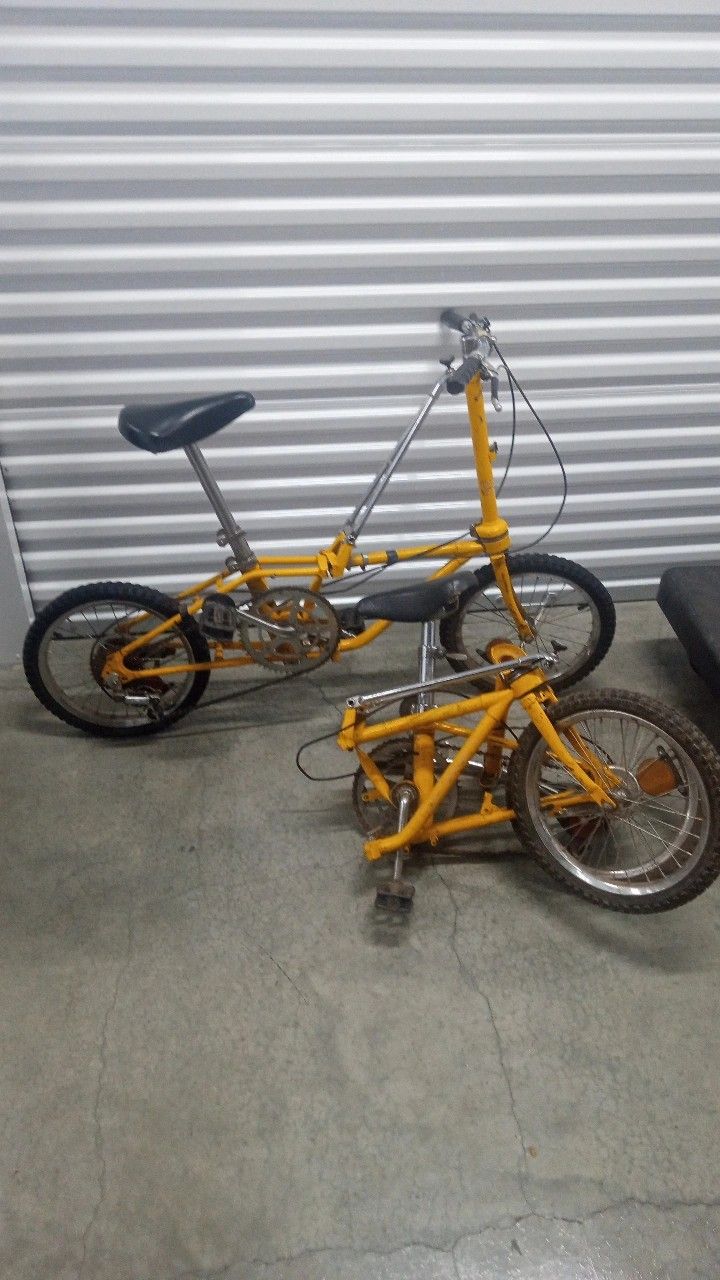2 Matching Yellow Vintage Folding Bikes