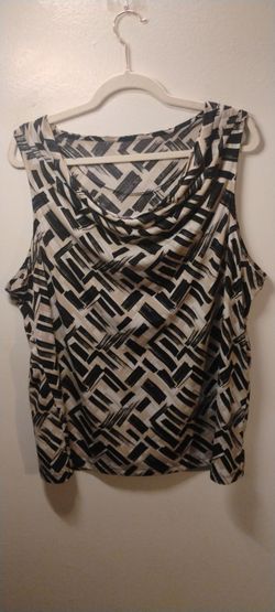 Beige black and brown geometric pattern blouse.