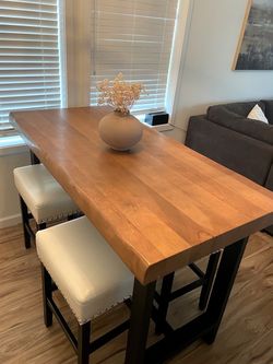 60” counter height table + 4 cream stools
