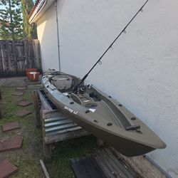 Fishing kayak with paddle