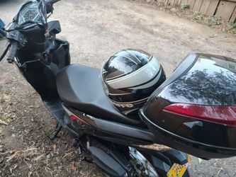 2014 scooter runs good and accurate condition has insurance and tags for a year tax is good for two years 1500 bucks