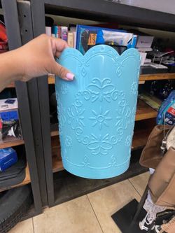 Small blue trash can bins