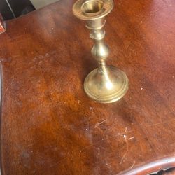 This is a vintage brass candlestick holder. 