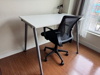 White Desk and Black Mesh Office Chair