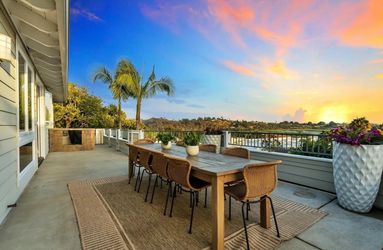 Outdoor Wood Dining Table with 8 Wicker Chairs