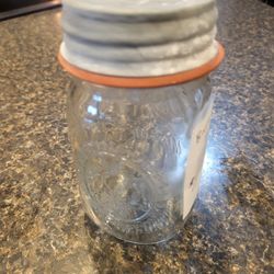 Ball Mason glass canning jar with silver cap lid 