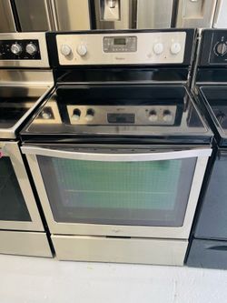 Whirlpool stainless steel stove; includes a receipt for a 60-day warranty.