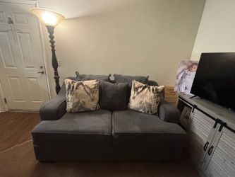 2 Gray Couches with decorative pillows