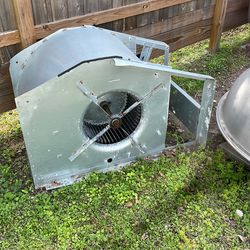 centrifugal blower housing, commonly known as a "squirrel cage" fan, likely used in an HVAC system or a similar ventilation setup.