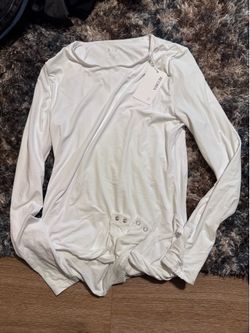 Brand new with tags- White body suit. Size large! $ 10 cash  Pickup on Ellsworth