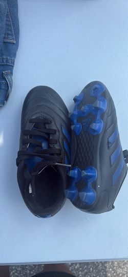 Kids soccer cleats and shin guard