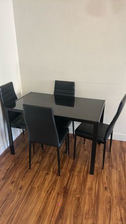 Black dining table with 4 chairs