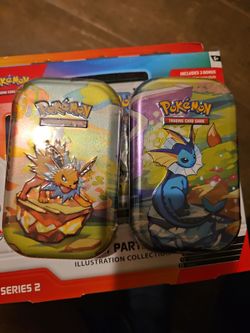 Pokemon prismatic evolutions tin vaporeon jolteon