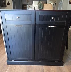 Black tilt out trash cabinet with trash cans