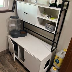 Cat litter box enclosure with power outlet