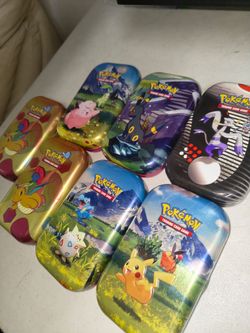 7 Pokemon Tins (empty)
