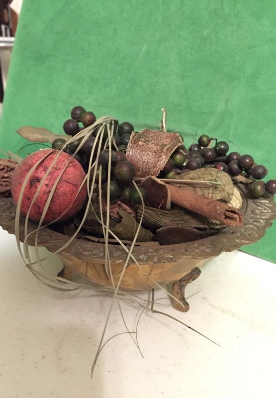 Brass bowl with feet and potpourri