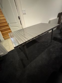 Solid stainless steel dining table