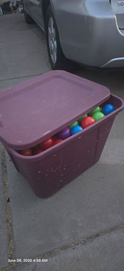 Kids play balls full bin