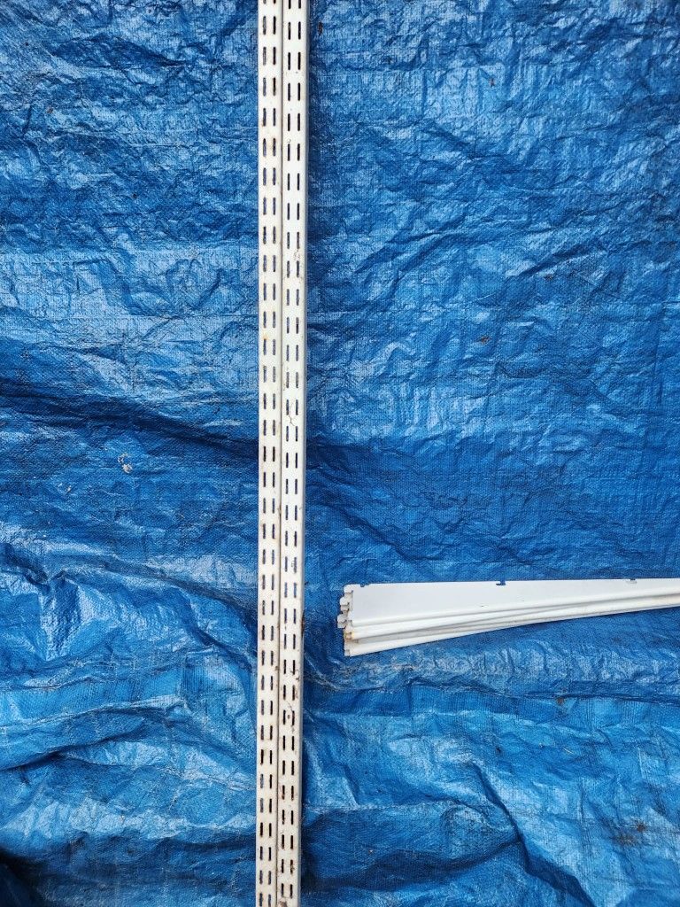 Garage wall shelving with adjustable supports