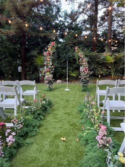 Wedding arch flowers and floral aisle markers