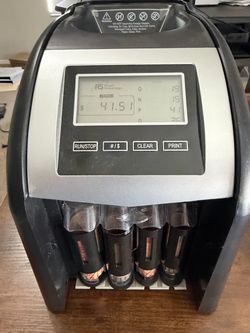 Coin sorting machine w/coin rolls