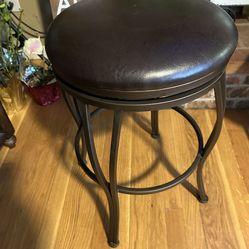 Swivel bar stool dark brown. Read Description