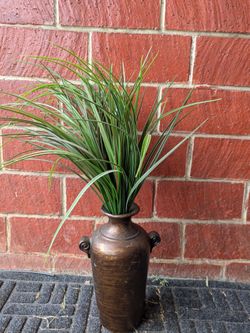 Artificial grass with brown gold vase
