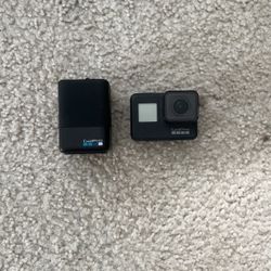 GoPro 7 Black + Battery Charger & Batteries 